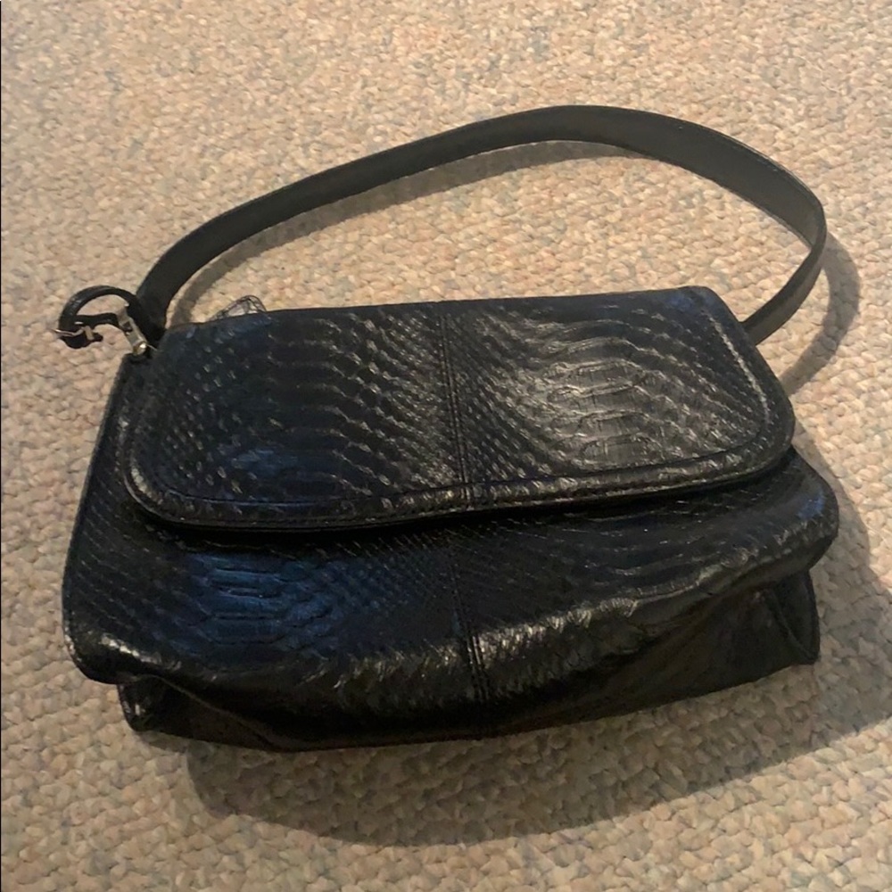 Black snake skin shoulder bag.